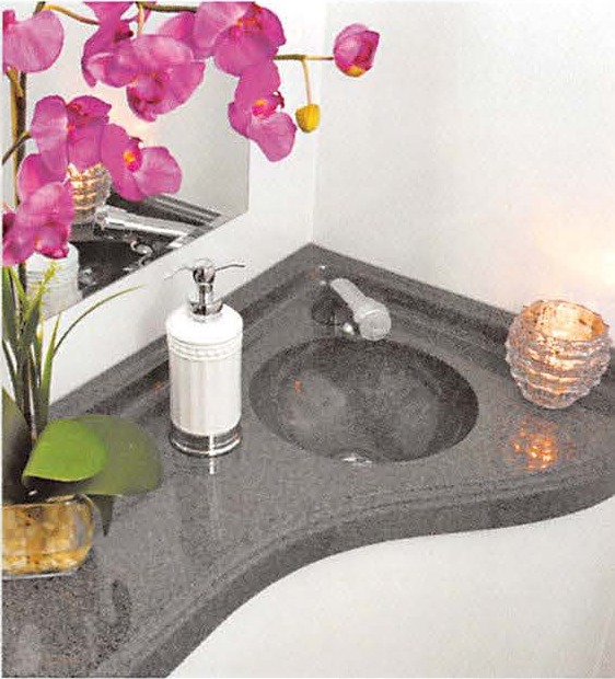 Suite vanity — stone-look countertop, running-water sink and beveled glass mirror